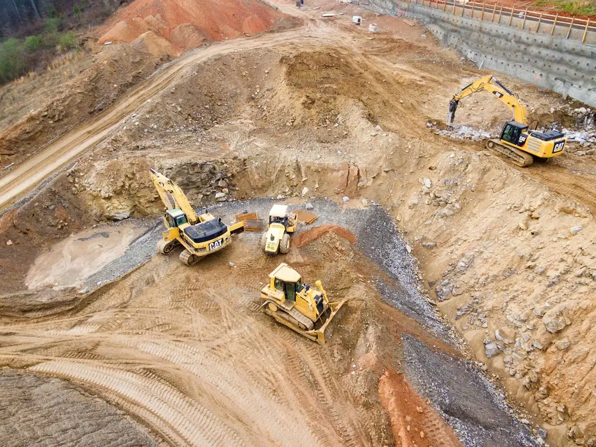 Aerial view of excavators on open-pit benches